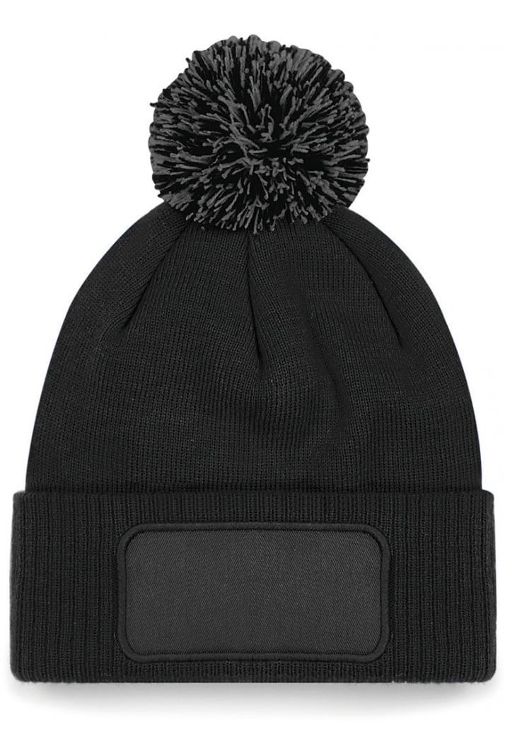 Muts met drukvlak en pompom